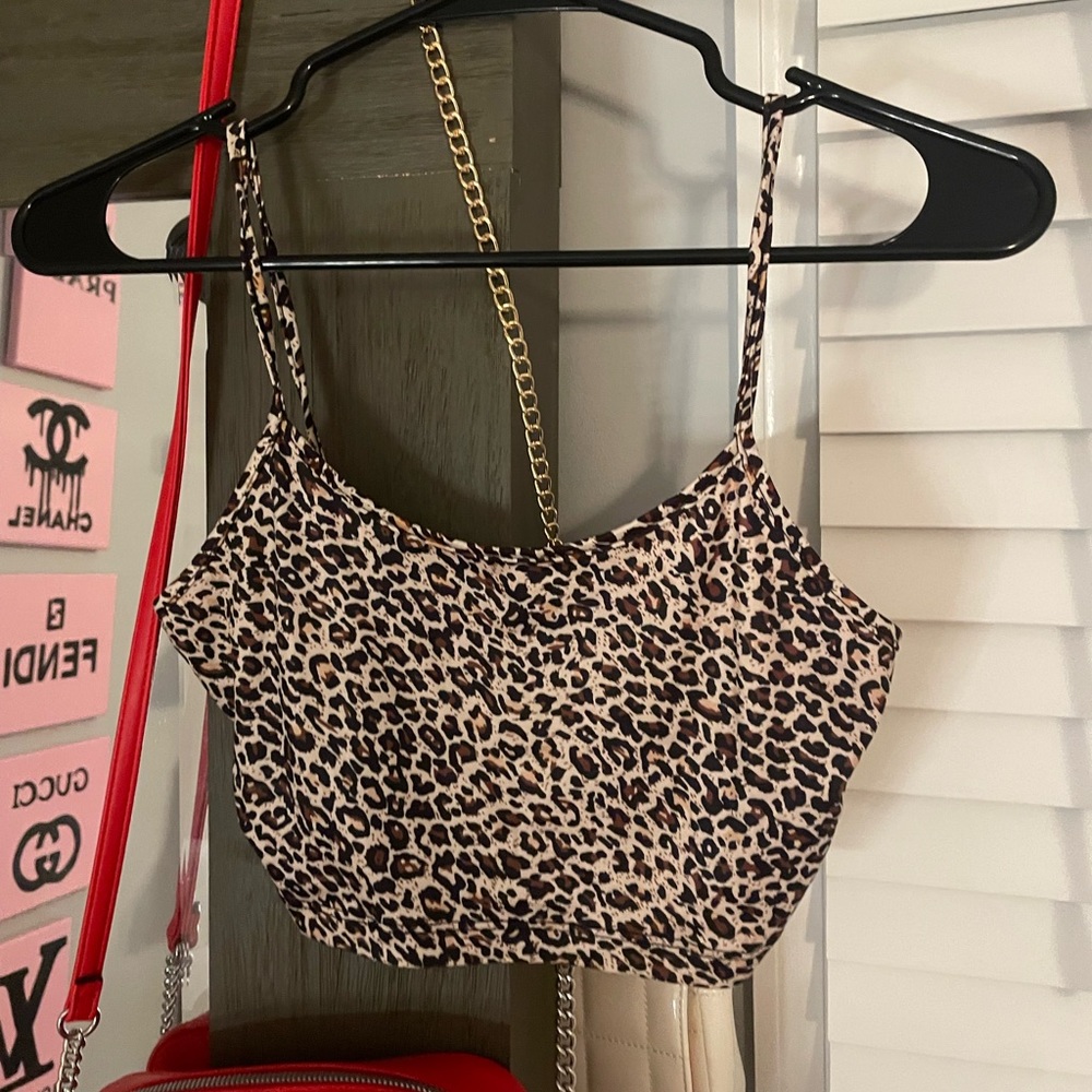 Selling all 3 of these cheetah tops together. All a size small.